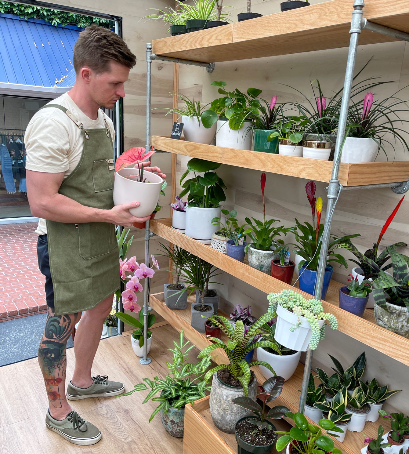 Owner Robert Moffitt inside his mobile shop gone greenhouse