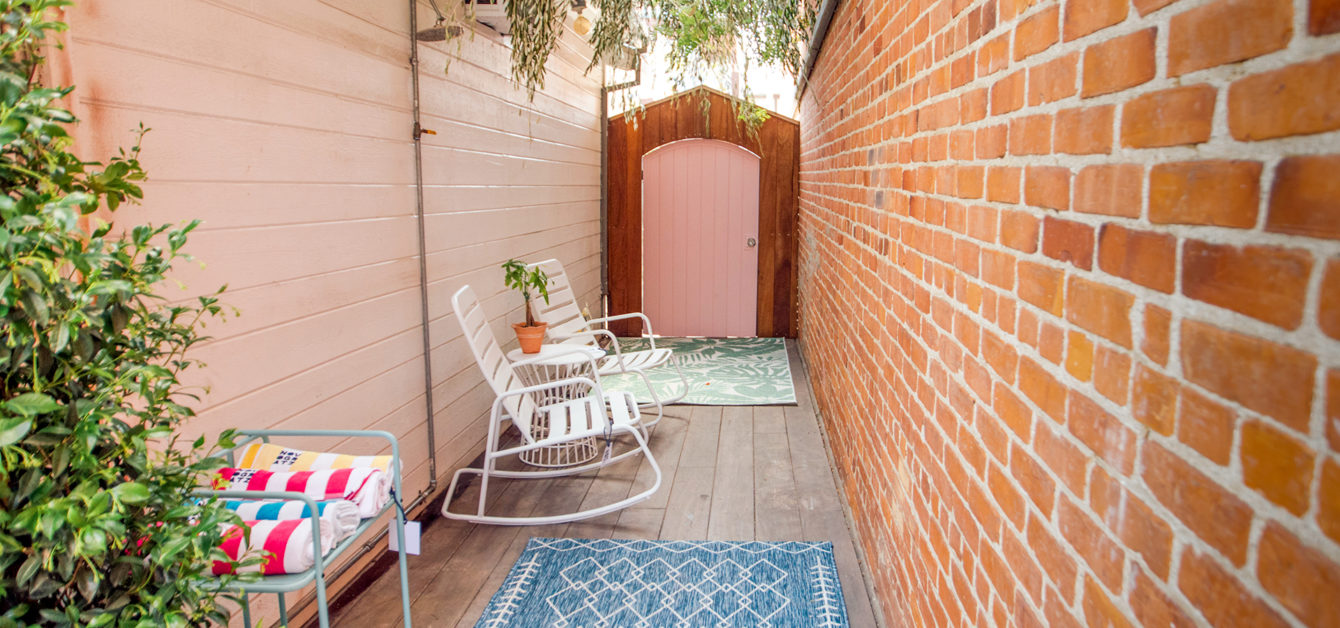 A Roberta Rocker set in white and outdoor space