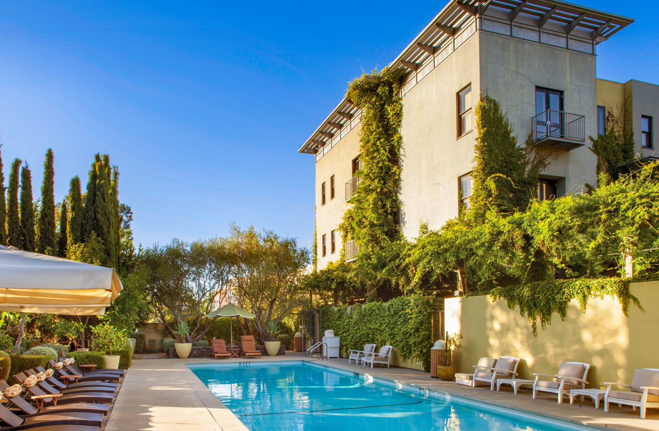 The charming, French garden-like setting at the pool at Hotel Healdsburg